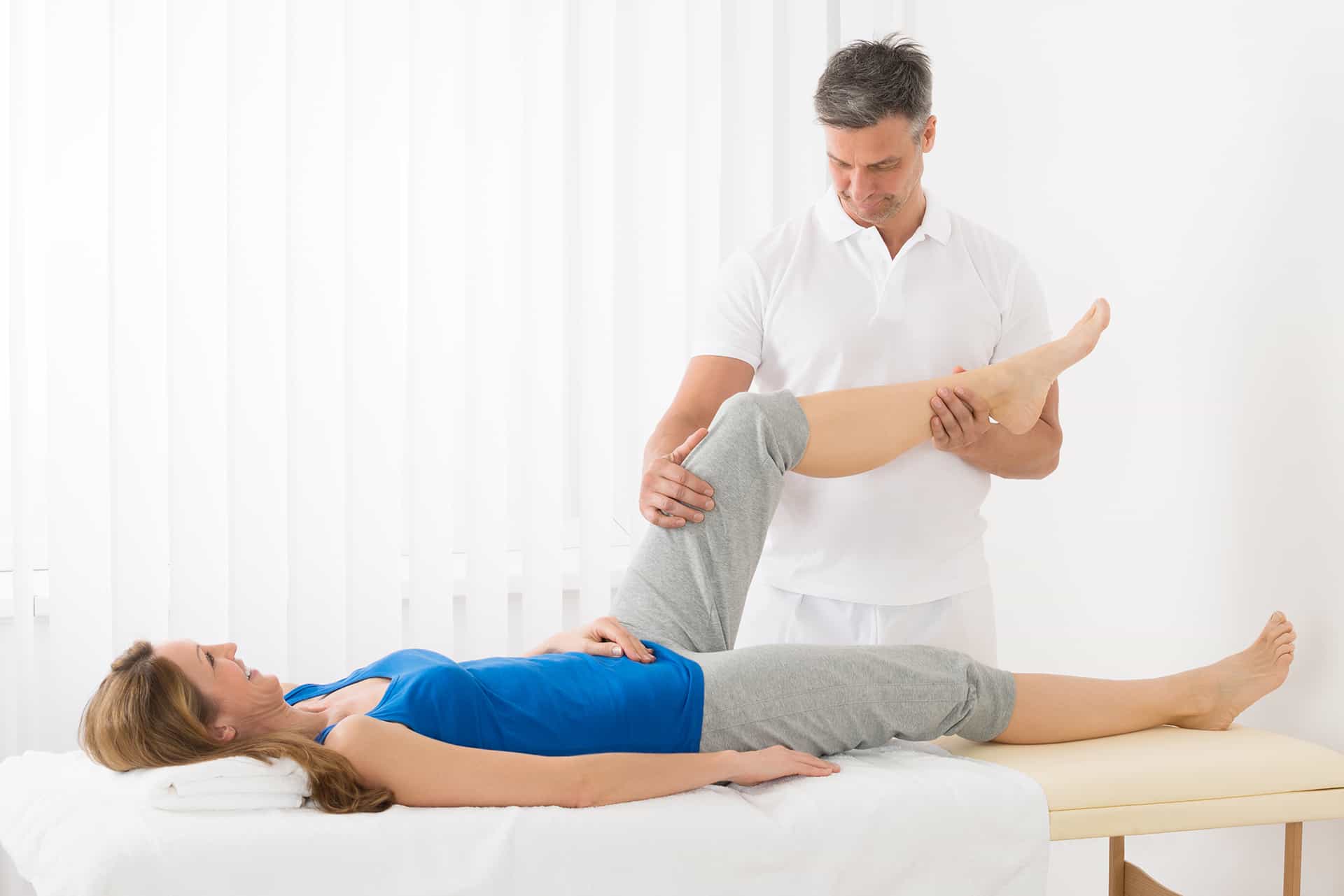 Woman Receiving Leg Massage in Spa